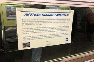 Poster in subway car window announcing “Another Transit Farewell!”