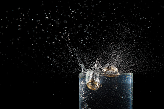 two rings inside a cup of water