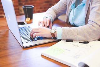 A student typing on a keyboard