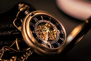 Image of a detailed bronze/gold pocket watch