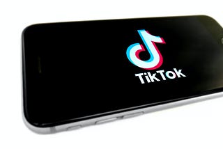 A phone with the TikTok logo on the screen.