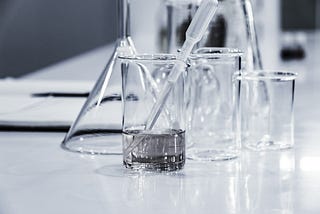 Science lab equipment on table.