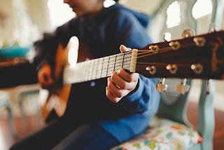 Are acoustic guitar lessons harder?