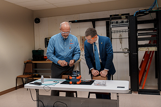 Joe Gambill, Training Director of SBJATC, performs a demonstration for Secretary Buttigieg