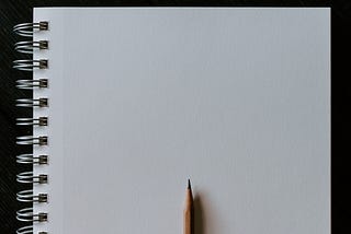 A pencil against a blank page