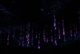 An artistic representation of data. Data is shown as a warped surface made out of many dots. Some of the dots appear to glow and emit colourful articles, symbolising relevant data points.