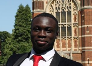 The author, smiling, at Selwyn College, Cambridge