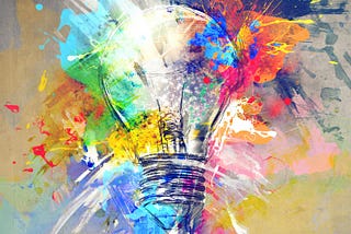 A painting of a lightbulb with lots of colours coming of it