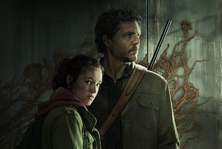 Joel and Ellie, the two main characters from the HBO television show The Last Of Us, standing in front of a concrete wall covered in vines.