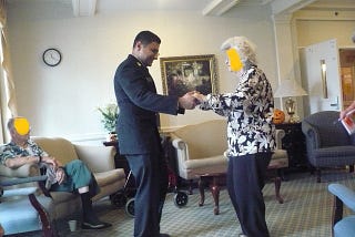 A picture of me in my naval uniform, dancing with one of the ladies at the nursing home.