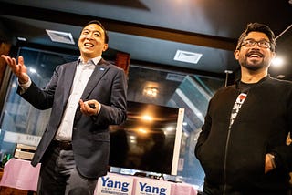 A picture of andrew Yang standing next to former mayor candidate Carlos Menchaca at a campaign event