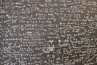 A blackboard with a lot of statistical calculations
