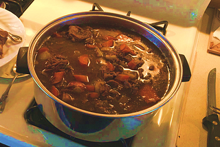A pot of stew on a stove