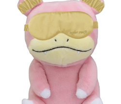 A slowpoke wearing a Taylor Swift branded sleep mask and matching earplugs.