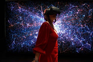 a young lady wearing a virtual reality headset looking at a cosmic sky with a background of nebula-like colors and electronic patterns