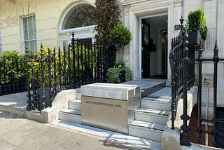 sesame access systems wheelchair lift at the front of a house for their front door access.