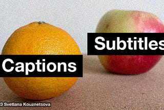 An orange with a label “Captions” and an apple with a label “Subtitles” stand to each other on a surface.