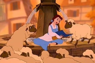 Screencap of Belle reading a book to some sheep from Disney’s Beauty and the Beast