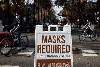 Here’s Why Vaccinated People Still Need to Wear a Mask