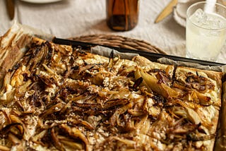 A fennel, ricotta and onion puff pastry pizza