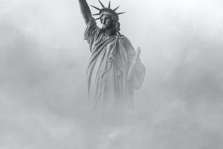 Photo of the Statue of Liberty enveloped in fog