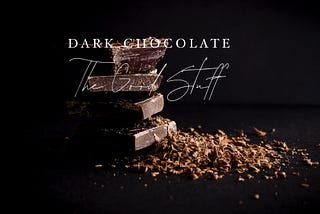 Color photo of shaved dark chocolate and cut pieces, that reads, dark chocolate, the good stuff.