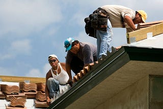 Roofing professionals at work.