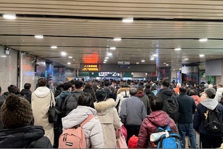 A picture of a busy exit passagway at Beijing West railway station