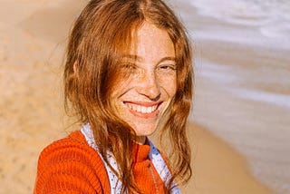 A woman smiling.