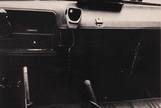 NYPD car interior circa 1975 with mounted radio. Photo from “Police Work” by Leonard Freed.