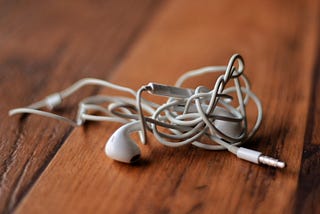 How tangled earbuds tell a story on society.