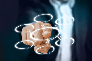business man drawing a flow chart with circles and arrows