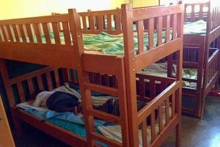 baby sleeping on a shelter bunk bed