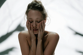 A woman looks vulnerable