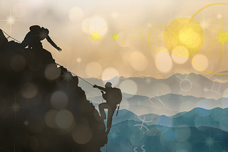 Image of two people climbing a mountain, with one at the summit helping another up.
