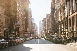 New York City street with shops and cars