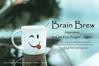 White coffee cup with black smiley wink face with red tongue sticking out — representing Brain Brew, Inspiration to Get Your Noggin’ Joggin’, writing by Christine McDonald, writer and spiritual lifestyle coach.