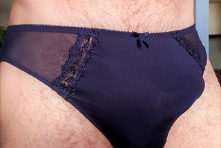 Male body looking fabulous in black ladies’ knickers