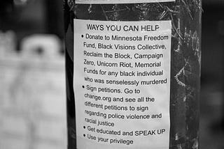 Telephone pole with flyer for ways to help the black lives matter movement