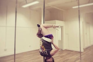 Pole fitness variation: Poling while pregnant.
