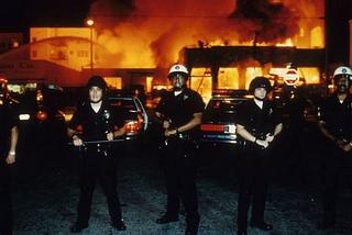 LAPD officers stand guard as fire units battle a blaze on 19th St. & Adams Blvd April 30th, 1992 Photo By Patrick Downs