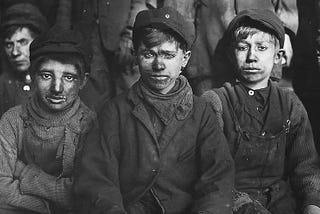 “Group of breaker boys — those who separated coal from impurities by hand” by Hine, Lewis on RawPixel