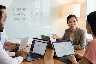 Manager leading a digital team with empathy during a virtual meeting on laptops and video screens