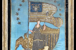 Woman holding flag with shield and eagle behind her