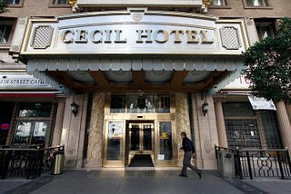 A visitor arrives at the hotel Cecil on Wednesday Feb. 20,2013 where the body of a woman was found wedged in one of the water tanks on the roof.