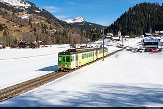 Traveling with the green railcars through the February landscape in the canton of Vaud (Photo…