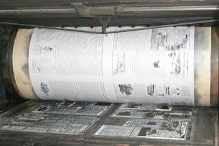 The bed of a metal type and print roller of a Miehle Model of the 1960s. I used it as the opening photo to symbolize freedom of the press.