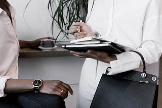 Two people talking in a coffee shop