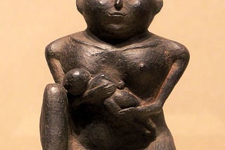 breastfeeding bronze statue looking straigth at you