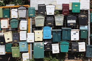 A colorful collection of mailboxes.